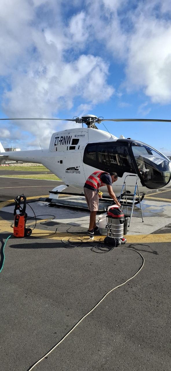 Warren Moore's team detailing an Airbus helicopter on the apron for Cape Town Helicopters